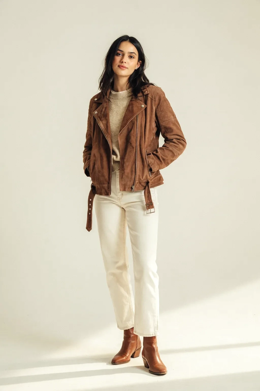suede jacket and white jeans