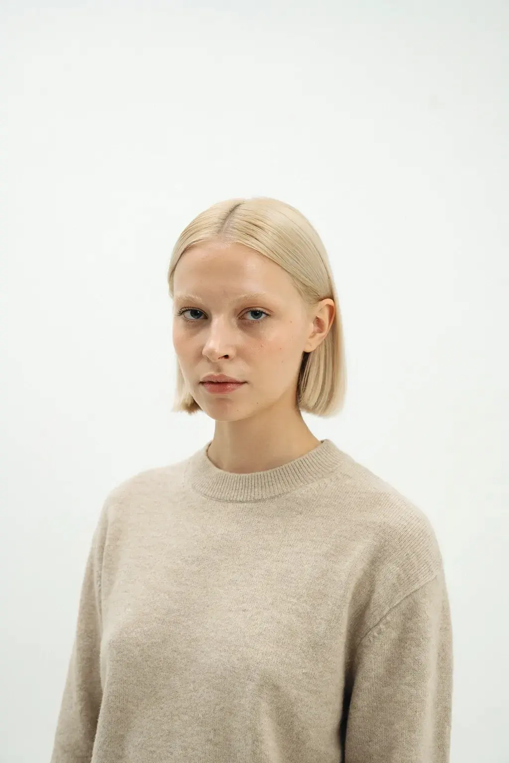 cashmere crewneck and blonde bob