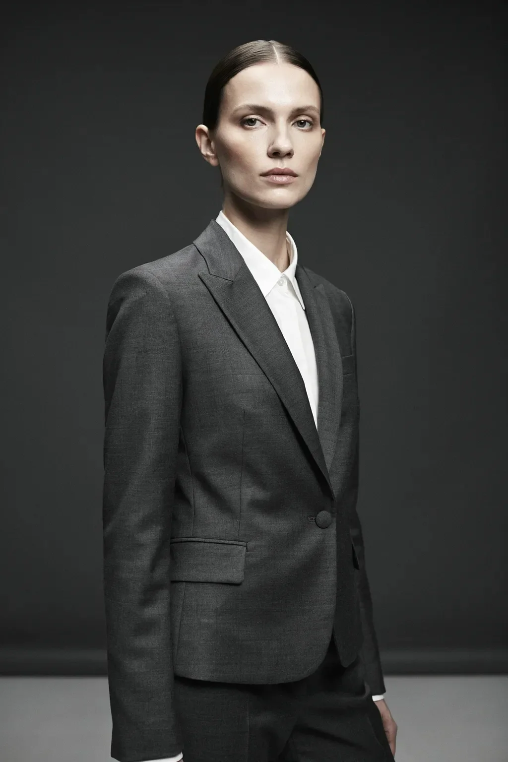 tailored suit and sleek bob